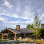 Mountain ranch patio design feature stone patios and various paths and native plantings.